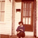 Alma Martin sitting on door step